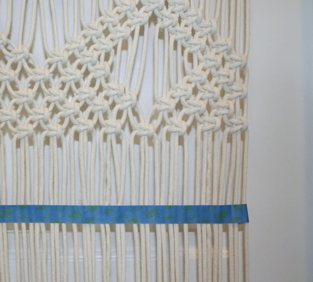 masking tape on macrame wall hanging