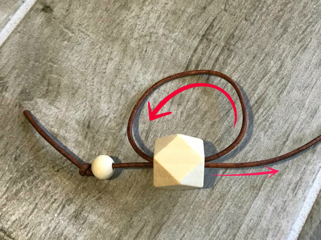 2mm leather cording scissors round wooden beads in a variety of sizes (6 small, 10 medium, 5 large) polygon shape wooden beads (20 individual beads used for this project) hot glue gun