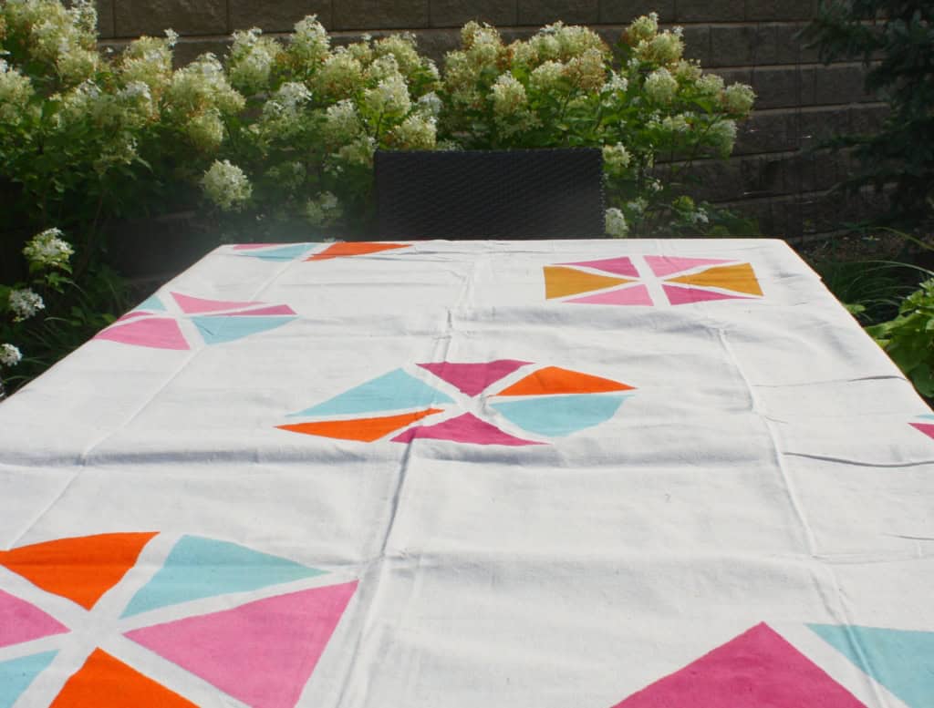 stenciled drop cloth as tablecloth