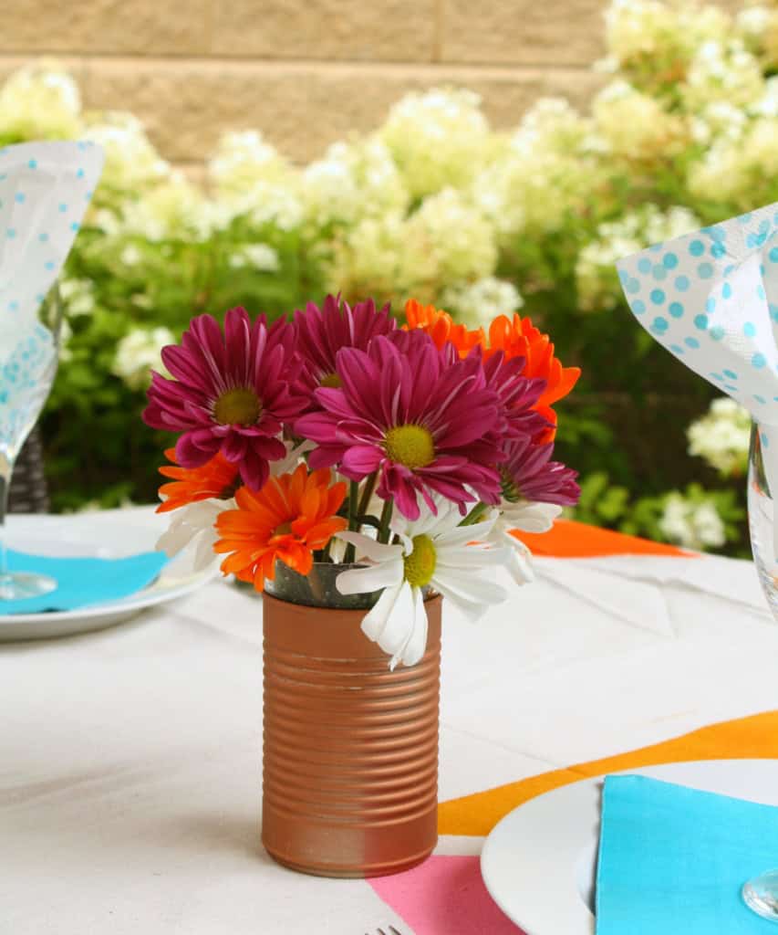 painted tin can as flower vase