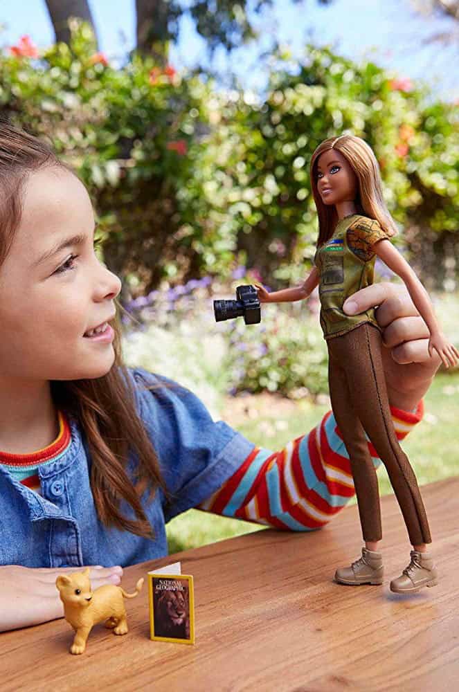 girl playing with barbie
